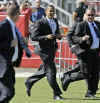 Barack Obama runs to the stage at a campaign rally in Sarasota Florida on October 30, 2008. Secret Service agents flank Obama who is known as "Renegade" by his Secret Service agents.