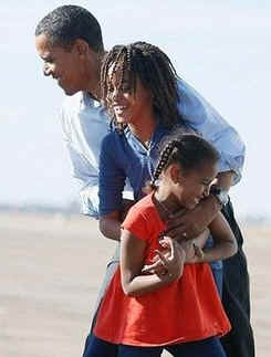 Barack Obama is devoted two his wife Michele and their two daughters Malia and Sasha. Photo: Barack greets his two daughters, Malia, and Sasha, after arriving at Pueblo, Colorado airport on November 1, 2008 during Obama's final Presidential campaign swings.