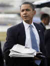 Barack Obama arrives at Philadelphia International Airport carrying his two Blackberrys.