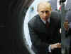 Russia's Putin says he has received positive signals from President-elect Barack Obama that NATO will not be enlarged.