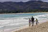 Barack Obama walks along the beach with his children on a family trip to Kailua Hawaii on August 12, 2008.