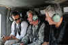 BarackObama chats in helicopter on July 21, 2008 over Baghdad Iraq with General Petraeus.