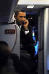 Barack Obama on the phone at Reagan Airport after White House visit with President Bush on November 10, 2008.