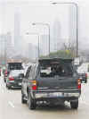 Barack Obama's motorcade under heavy security on the way to Obama's Chicago office on November 14, 2008.