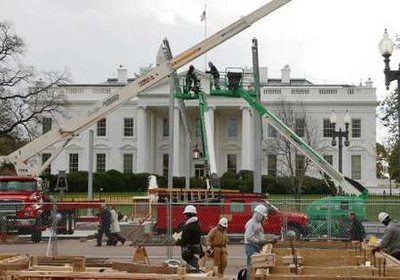 Construction begins on the dignitaries reviewing stand along the Inaugural Parade route (White House in the background.) Nov 18, 2008.