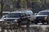 Barack Obama's SUV motorcade near his Kenwood area home readies for a trip to Obama's gym on November 19, 2008.