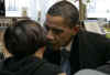 President-elect Barack Obama whispers to deli patron. Obama had lunch in Chicago with his transition advisor Valerie Jarrrett at Manny's Deli in Chicago. Obama's every moment was watched by surprised staff and patrons.