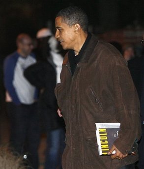 Barack Obama with newly released Abraham Lincoln book. President-elect Obama leaves a friend's house for his motorcade in Chicago on 11/22/08.