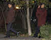 Michelle and Barack Obama walk to motorcade after dinner with a friend near Obama's Chicago home on November 22, 2008.