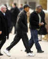 Barack Obama is followed by Secret Service agents as he walks to the University of Chicago to play basketball on November 23, 2008.