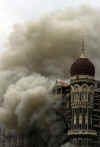 President-elect Barack Obama calls Indian Prime Minister Singh. Three day battle in Mumbai kills over 150 people. November 29th photo shows the Taj Mahal hotel on fire after another explosion.