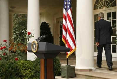  President George W. Bush leaves the podium in the Rose Garden after congratulating Obama, promising "a smooth transition." Photo taken at White House, in Washington DC, on November 5, 2008.