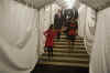 The Barack Obama family on the curtained stairwell bakstage after Obama's victory speech in Chicago.
