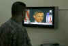 A US soldier watches Barack Obama on TV on November 5, 2008 in Baghdad Iraq.