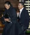 Michelle and Barack Obama leave Chicago's Spiaggia Restaurant on November 8, 2008.