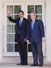 President George W. Bush and President-elect Barack Obama wave before entering the White House on November 10, 2008.