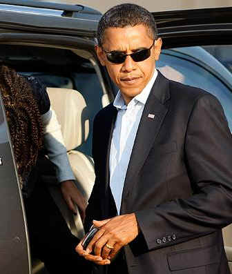 Obama exits SUV, with Blackberry in hand, at Ohio's Port Columbus International Airport in on November 2, 2008.