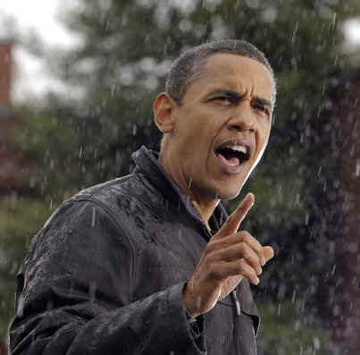 Barack Obama speaks in a rain storm at a presidential campaign rally in Chester, Philadelphia on October 28, 2008.