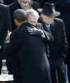 Barack Obama's daughters and President George W. Bush congratulate Obama after his Inaugural speech.