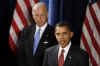 Joe Biden listens as Barack Obama announces his new Energy and Environment Team at a Chicago media conference on December 15, 2008.