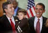 Chicago Public School chief Arne Duncan holds his 4 year old son. Barack Obama announced Duncan as nominee for Education Secretary at a press conference at the Dodge Renaissance Academy in Chicago on December 16, 2008.