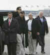 Barack Obama arrives with a heavy security detail at Chicago's O'Hare Airport on December 20, 2008. The Obama family is taking a charter plane for a 12-day Christmas vacation in Hawaii.