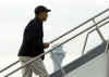 Barack Obama boards a charter plane at Chicago's O'Hare Airport on December 20, 2008. The Obama family is taking a 12-day Christmas vacation in Hawaii.