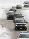 Barack Obama's motorcade travels through snow at Chicago's O'Hare Airport on December 20, 2008. The Obama family is taking a charter plane for a 12-day Christmas vacation in Hawaii.