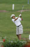 Barack Obama practices his golf swing on the driving range at the course near his Kailua, Hawaii vacation home on December 21, 2008.