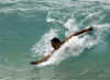 Barack Obama body surfs at Sandy Beach near Honolulu on August 14, 2008.