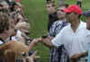 Barack Obama greets the crowd after playing a round of golf with Obama's friends at the Mid Pacific Country Club in Kailua, Hawaii on December 29, 2008.