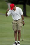 Barack Obama bows to the crowd after sinking a lengthy 18th hole putt. Obama played a round with friends at the Mid Pacific Country Club in Kailua, Hawaii on December 29, 2008.