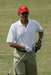 Barack Obama re-attaches his Blackberry at the golf driving range at the Mid Pacific Country Club in Kailua, Hawaii on December 29, 2008.