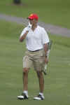Barack Obama gestures for quiet as players in his group play golf at the Mid Pacific Country Club in Kailua, Hawaii on December 29, 2008.
