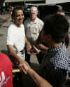 Barack Obama greets the crowd after playing basketball at Punahou School in Honolulu, Hawaii on december 30, 2008. Barack Obama graduated from Honolulu's Punahou School in 1979.