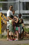 Barack Obama with his daughters and friends at the entrance to the Honolulu Zoo on December 30, 2008. Barack Obama went to the Honolulu Zoo with family and friends.