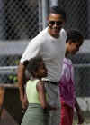 Barack Obama with his daughters Sasha and Malia at the entrance to the Honolulu Zoo on December 30, 2008. Barack Obama went to the Honolulu Zoo with family and friends.