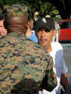 Barack Obama shakes hand with US Marine after workout at the Semper Fit gym on the Kaneohe Bay Marine Corps Base in Kailua, Hawaii on December 31, 2008.