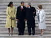 Barack and Michelle Obama escort George and Laura Bush to their waiting helicopter for a flight to Andrews Air Base.