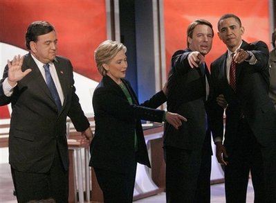 Democratic hopefuls point to audience after debate in Manchester, New Hampshire on January 5, 2008. Eleven months later Clinton and Richardson would receive cabinet posts from Barack Obama.