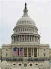 Large US flags dominate the front of the Capitol Building in readiness for the inauguration of President Barack Obama on January 20, 2009.