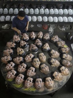 Worker in Rio de Janeiro, Brazil cleans Obama masks on January 16, 2009. The masks are the hottest item for the 2009 Carnival.