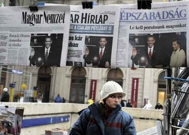 Newsstand seller in Budapest, Hungary. Barack Obama's presidential inauguration dominates international newsstands.
