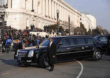 Under heavy security President Obama's high-tech GM Cadillac limousine leads the Inaugural Parade from the Capitol Building to the White House.