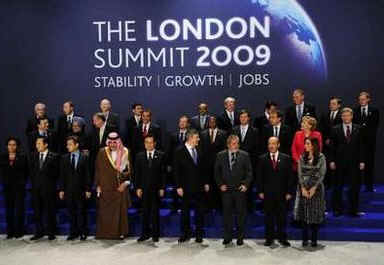 President Barack Obama and the G20 leaders return to the stage for a second G20 group photo after Canadian Prime Minister Stephen Harper was missing from the first group photo. 
