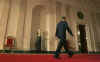 President Barack Obama walks down the Cross Hall of the White House after holding his first news conference as President in the East Room of the White House. The questions centered mostly on the President's economic stimulus package and the urgency of passing the financial bill.