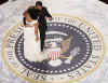 First Lady Michelle Obama and President Barack Obama wow the cameras and attendees as they dance on the Presidential Seal at the Commander In Chiefs Inaugural Ball at the National Building Museum in Washington.