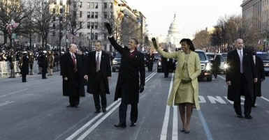 Secret Service agents stay close to the President and the First Lady on their walk down Pennsylvania Avenue.