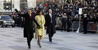 Secret Service agents stay close to the President and the First Lady on their walk down Pennsylvania Avenue.