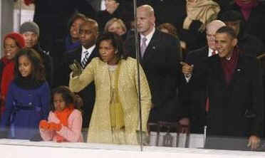 First Lady Michelle Obama and President Barack Obama enjoy the parade with family and friends.